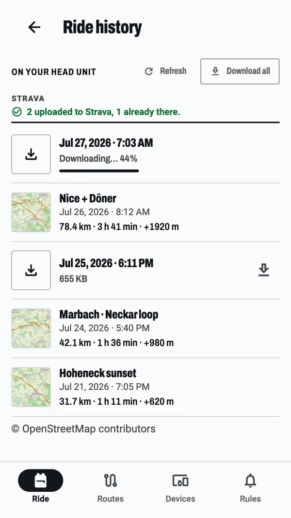 Ride history: a ride downloading off the bike computer at 44 %, a note that two rides went up to Strava and one was already there, and the rides already on the phone, each with a small map of where it went.