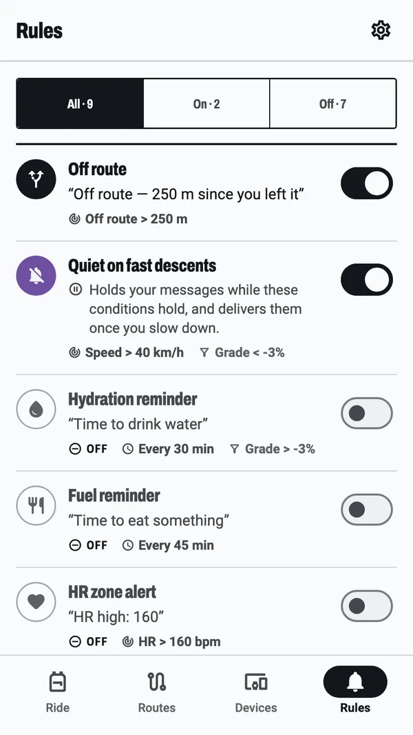 The Rules tab: nine rules, two switched on, among them an off-route warning and a hold on messages during fast descents, each showing the words it puts on the bike computer and what sets it off.